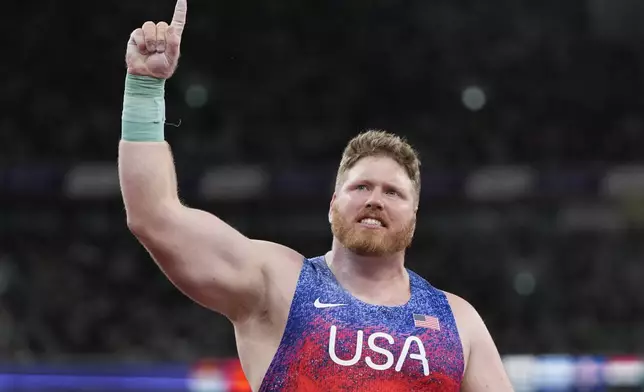 United States' Ryan Crouser reacts as he competes in the men's shot put final at the World Athletics Championships in Tokyo, Saturday, Sept. 13, 2025. (AP Photo/Ashley Landis)