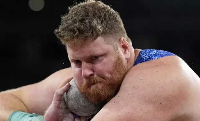 United States' Ryan Crouser makes an attempt in the men's shot put final at the World Athletics Championships in Tokyo, Saturday, Sept. 13, 2025. (AP Photo/Matthias Schrader)