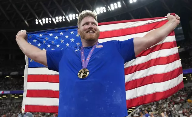 United States' Ryan Crouser celebrates after winning the gold medal in the men's shot put final at the World Athletics Championships in Tokyo, Saturday, Sept. 13, 2025. (AP Photo/Ashley Landis)