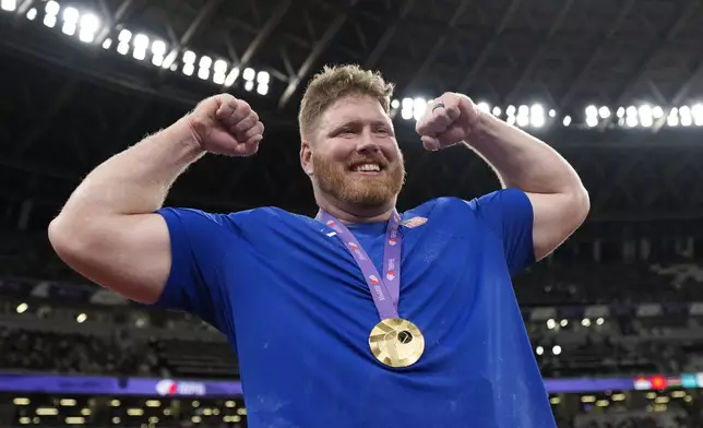 United States' Ryan Crouser celebrates after winning the gold medal in the men's shot put final at the World Athletics Championships in Tokyo, Saturday, Sept. 13, 2025. (AP Photo/Ashley Landis)