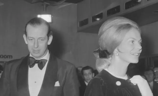 FILE - Prince Edward and Katherine, Duke and Duchess of Kent, pictured on arrival in the foyer of the Odeon Theatre in London, England, for the premiere of "On Her Majesty's Secret Service", on Dec. 18, 1969. (AP Photo/Robert Dear, File)