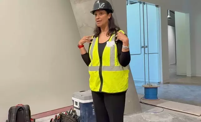 Kama Pierce, curator of a new g gallery on the Reconstruction Era at the National Center for Civil and Human Rights, describes the future exhibit's contents on Wednesday, Sept. 10, 2025 in Atlanta. (AP Photo/Michael Warren)