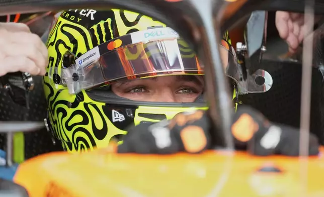 McLaren driver Lando Norris of Britain sits in pit lane during the first training for the Azerbaijan Formula One Grand Prix in Baku, Azerbaijan, Friday, Sept. 19, 2025. (AP Photo/Darko Bandic)