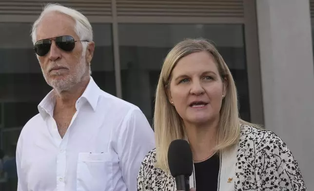 IOC President Kirsty Coventry, right, and Milano Cortina 2026 Foundation President Giovanni Malago visit the Olympic and Paralympic Village in Milan, Italy, Thursday, Sept. 18, 2025. (AP Photo/Antonio Calanni)