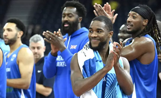 Britain's team celebrates after the Eurobasket, European Basketball Championship, group B match between Montenegro and Great Britain in Tampere, Finland, Wednesday, Sept. 3, 2025. (Heikki Saukkomaa/Lehtikuva via AP)