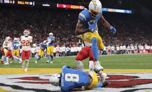 Los Angeles Chargers wide receiver Quentin Johnston scores against the Kansas City Chiefs during the first half of an NFL football game, Friday, Sept. 5, 2025, in Sao Paulo. (AP Photo/Jeff Lewis)