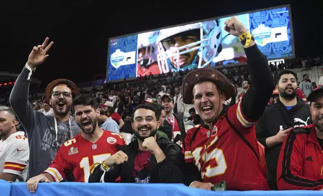 Fans cheer during warm ups before an NFL football game between the Kansas City Chiefs and the Los Angeles Chargers, Friday, Sept. 5, 2025, in Sao Paulo. (AP Photo/Fernando Llano)