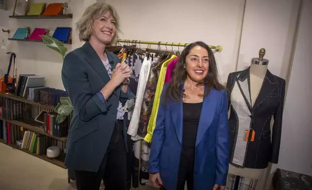 Stylist Natalie Tincher, left, and Deborah Borg discuss how to pull off the no makeup makeup look at the women's clothing store Dalya on Wednesday, Aug. 27, 2025, in New York. (Photo by Andy Kropa/Invision/AP)