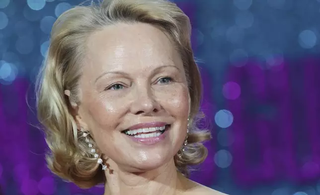 FILE - Pamela Anderson appears at the premiere of the film "The Naked Gun" in London on July 22, 2025. (AP Photo/Kirsty Wigglesworth, File)