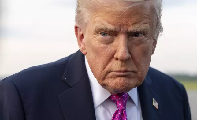 President Donald Trump speaks with reporters before he departs on Air Force One at Morristown Airport, Sunday, Sept. 14, 2025, in Morristown, N.J. (AP Photo/Alex Brandon)