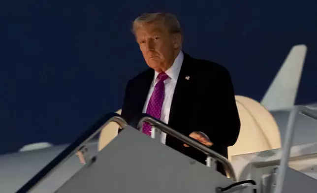 President Donald Trump arrives on Air Force One, Sunday, Sept. 14, 2025, at Joint Base Andrews, Md. (AP Photo/Alex Brandon)