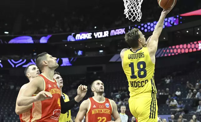 Viktor Gaddefors of Sweden goes for the basket during the Eurobasket, European Basketball Championship group B match between Sweden and Montenegro in Tampere, Finland, Monday, Sept. 1, 2025. (Heikki Saukkomaa/Lehtikuva via AP)