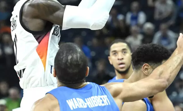 Germany's Dennis Schroeder plays the ball during the Eurobasket, European Basketball Championship, group B match between Germany and Great Britain in Tampere, Finland, Monday, Sept. 1, 2025. (Heikki Saukkomaa/Lehtikuva via AP)