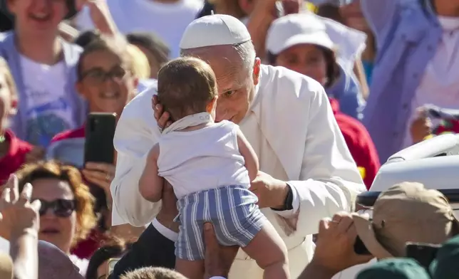 Pope Leo XIV arrives in St. Peter's Square at the Vatican for an open-air jubiliar audience Saturday, Sept. 6, 2025. (AP Photo/Andrew Medichini)