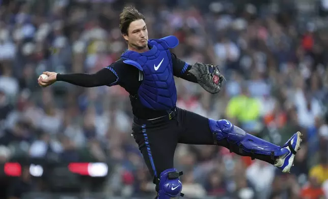 Detroit Tigers catcher Dillon Dingler (13) throws to first base for an out on a Chicago White Sox's Chase Meidroth bunt in the fourth inning during a baseball game Friday, Sept. 5, 2025, in Detroit. (AP Photo/Paul Sancya)