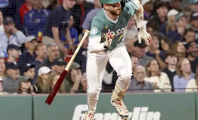 Boston Red Sox's Trevor Story starts to run to first base on a flyout during the fourth inning of a baseball game against the New York Yankees, Friday, Sept. 12, 2025, in Boston. (AP Photo/Mark Stockwell)