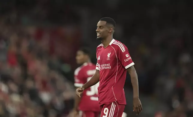 Liverpool's Alexander Isak walks during the Champions League opening phase soccer match between Liverpool and Atletico Madrid at Anfield stadium in Liverpool, England, Wednesday, Sept. 17, 2025. (AP Photo/Jon Super)