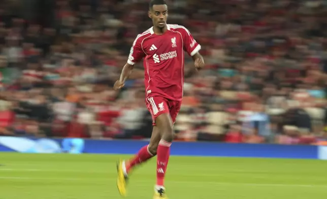 Liverpool's Alexander Isak runs during the Champions League opening phase soccer match between Liverpool and Atletico Madrid at Anfield stadium in Liverpool, England, Wednesday, Sept. 17, 2025. (AP Photo/Jon Super)