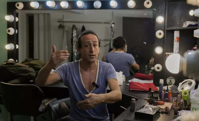 Alexandre Paulikevitch gives an interview backstage before his performace at a theatre in Beirut, Lebanon, Thursday, Sept. 11, 2025. (AP Photo/Hussein Malla)