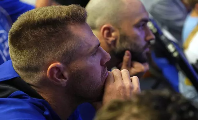 Los Angeles Dodgers' Freddie Freeman, left, listens as pitcher Clayton Kershaw speaks to the media after announcing his retirement at the end of the season prior to a baseball game against the San Francisco Giants Thursday, Sept. 18, 2025, in Los Angeles. (AP Photo/Mark J. Terrill)