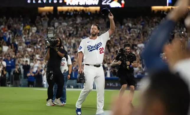 Los Angeles Dodgers starting pitcher Clayton Kershaw (22) tips his cap after being removed during the fourth inning of a baseball game against the San Francisco Giants in Los Angeles, Friday, Sept. 19, 2025. (AP Photo/Kyusung Gong)
