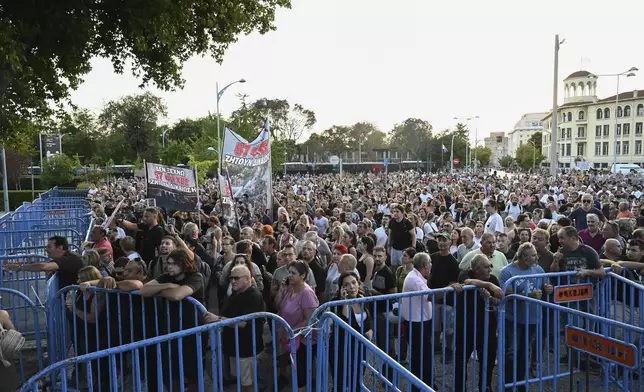 Protesters gather during a rally outside Thessaloniki's international trade fair where Prime Minister Kyriakos Mitsotakis delivered a keynote speech, at the northern city of Thessaloniki, Greece, Saturday, Sept. 6, 2025. (AP Photo/Giannis Papanikos)