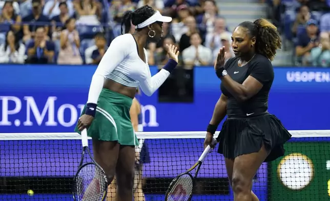 FILE - Serena Williams, right, and Venus Williams celebrate during their first-round doubles match against Lucie Hradecká and Linda Nosková, of the Czech Republic, at the U.S. Open tennis championships, Sept. 1, 2022, in New York. (AP Photo/Frank Franklin II, file)