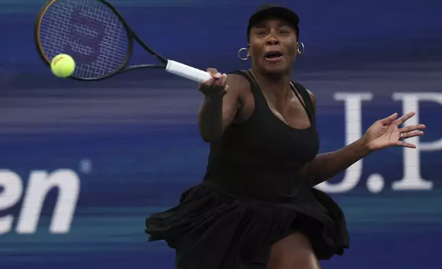 Venus Williams, of the United States, returns a shot with partner Leylah Fernandez, of Canada, during a quarterfinal doubles match at the U.S. Open tennis championships, Tuesday, Sept. 2, 2025, in New York. (AP Photo/Heather Khalifa)