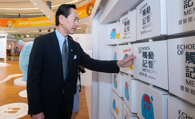 Club Steward Bernard Chan tours the JCCPA 25th Anniversary Presents: Echoes of Memory: An Interactive Journey exhibition.