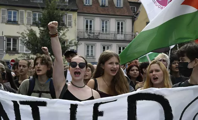 Protesters of the the "Block Everything" movement march during a rally in Strasbourg, eastern France, Wednesday, Sept. 10, 2025. (AP Photo/Pascal Bastien)