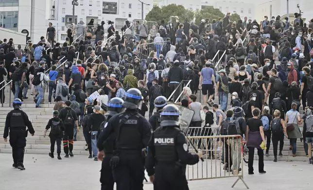 French police disperse protesters during a gathering of the "Block Everything" movement in Marseille, south of France, Wednesday, Sept. 10, 2025. (AP Photo/Philippe Magoni)