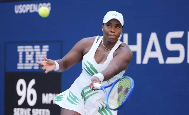 Taylor Townsend, of the United States, returns a shot against Barbora Krejcikova, of the Czech Republic, during the fourth round of the U.S. Open tennis championships, Sunday, Aug. 31, 2025, in New York. (AP Photo/Pamela Smith)