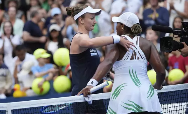 Barbora Krejcikova, of the Czech Republic, left, greets Taylor Townsend, of the United States, after she won the match during the fourth round of the U.S. Open tennis championships, Sunday, Aug. 31, 2025, in New York. (AP Photo/Pamela Smith)