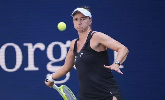 Barbora Krejcikova, of the Czech Republic, returns a shot against Taylor Townsend, of the United States, during the fourth round of the U.S. Open tennis championships, Sunday, Aug. 31, 2025, in New York. (AP Photo/Pamela Smith)