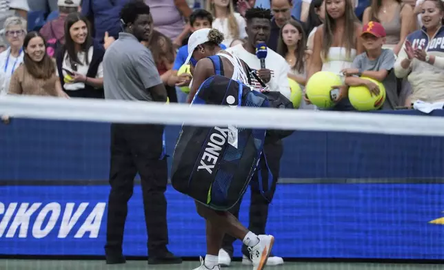 Taylor Townsend, of the United States, walks off the court after being defeated by Barbora Krejcikova, of the Czech Republic, during the fourth round of the U.S. Open tennis championships, Sunday, Aug. 31, 2025, in New York. (AP Photo/Pamela Smith)