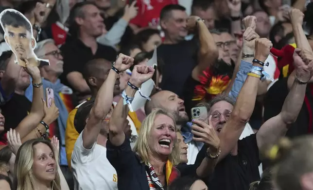 Germany fans cheer during the Eurobasket, European Basketball Championship final match between Turkey and Germany at the Riga Arena in Riga, Latvia, Sunday, Sept. 14, 2025. (AP Photo/Sergei Grits)