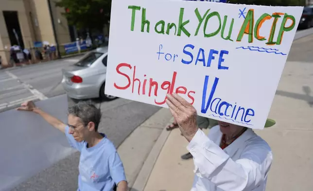 FILE - Demonstrators rally for support of the CDC during a meeting of the Advisory Committee on Immunization Practices, June 25, 2025, in Atlanta. (AP Photo/Mike Stewart, File)