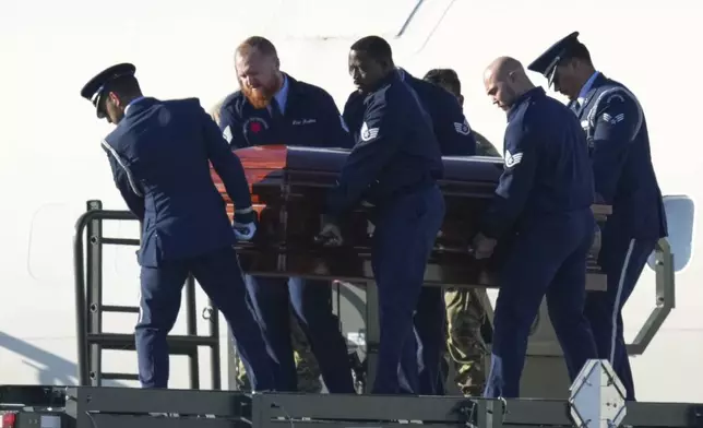 The casket containing the body of Charlie Kirk, the CEO and co-founder of Turning Point USA who was shot and killed on Wednesday is removed from Air Force Two at Phoenix Sky Harbor International Airport, Thursday, Sept. 11, 2025, in Phoenix. (AP Photo/Ross D. Franklin)
