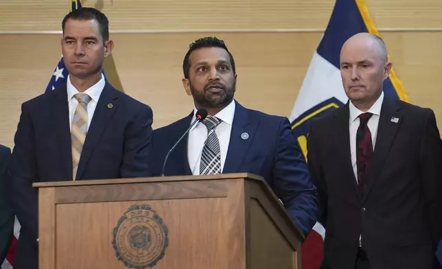 Kash Patel speaks at a news conference, Friday, Sept. 12, 2025, in Orem, Utah, as Utah department of public safety commissioner Beau Mason, left, and Utah Gov. Spencer Cox listen. (AP Photo/Lindsay Wasson)