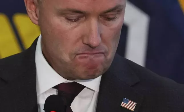 Utah Gov. Spencer Cox pauses as he speaks at a news conference, Friday, Sept. 12, 2025, in Orem, Utah. (AP Photo/Lindsey Wasson)
