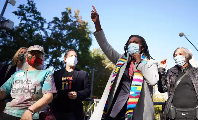 FILE - The Rev. Jacqui Lewis, senior pastor at Middle Collegiate Church, speaks during an interfaith gathering outside of the Judson Memorial Church near Washington Square Park in New York, Nov. 4, 2020. (AP Photo/Emily Leshner, File)