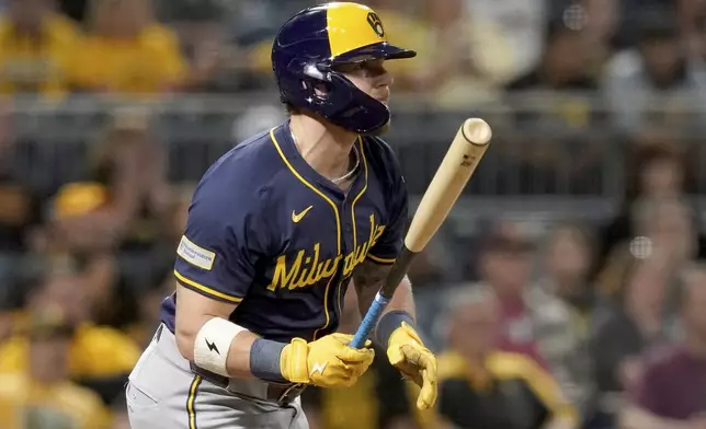 Milwaukee Brewers' Jake Bauers watches his RBI single during the sixth inning of a baseball game against the Pittsburgh Pirates, Friday, Sept. 5, 2025, in Pittsburgh. (AP Photo/Matt Freed)