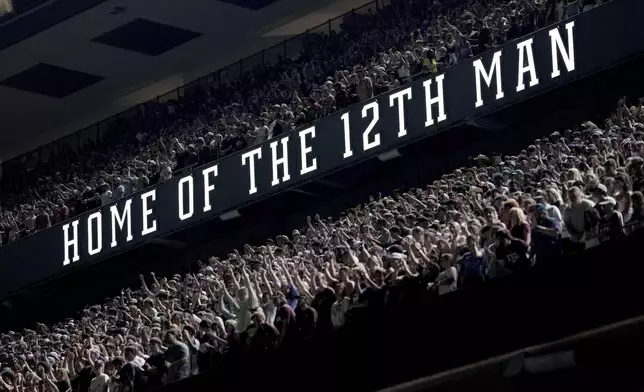 Texas A&amp;M students pack the top and middle deck of the East side of Kyle Field during Midnight Yell in College Station, Texas on Saturday, August 30, 2025. (AP Photo/Sam Craft)