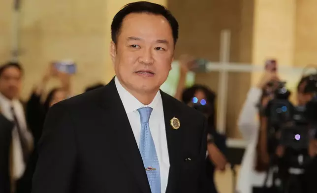 Leader of Bhumjai Thai Party Anutin Charnvirakul arrives at Parliament in Bangkok, Thailand, Friday, Sept. 5, 2025. (AP Photo/Sakchai Lalit)