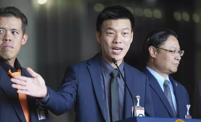 Leader of People's Party, Natthaphong Ruengpanyawut talks to reporters during a press conference at Parliament in Bangkok, Thailand, Wednesday, Sept. 3, 2025. (AP Photo/Sakchai Lalit)