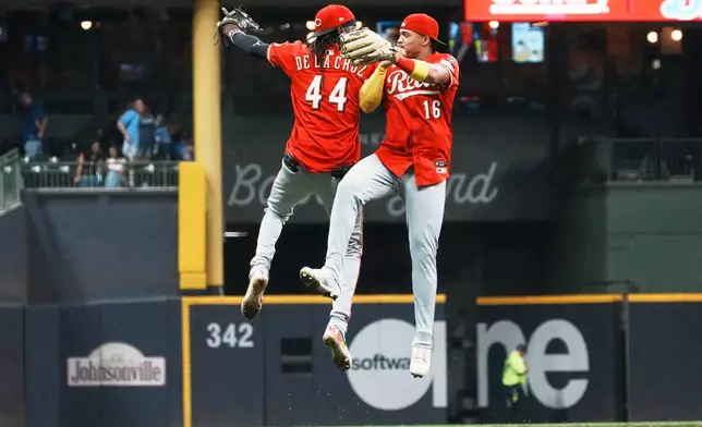 Cincinnati Reds' Elly De La Cruz and Noelvi Marte celebrate after a baseball game against the Milwaukee Brewers Saturday, Sept. 27, 2025, in Milwaukee. (AP Photo/Morry Gash)