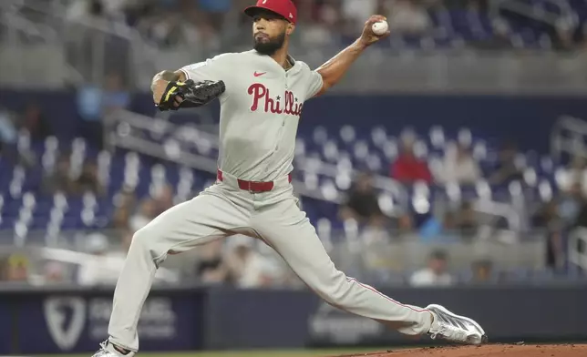 Philadelphia Phillies starting pitcher Cristopher Sánchez aims a pitch during the first inning of a baseball game against the Miami Marlins Friday, Sept. 5, 2025, in Miami. (AP Photo/Marta Lavandier)