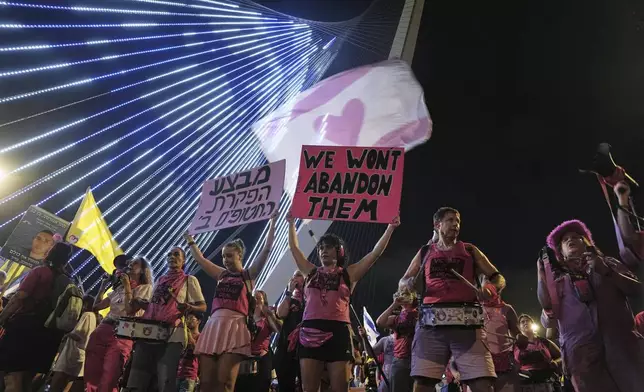 Relatives and supporters of Israeli hostages held in the Gaza Strip attend a rally demanding their release from Hamas captivity and calling for an end to the war, in Jerusalem, Saturday, Sept. 6, 2025. (AP Photo/Mahmoud Illean)