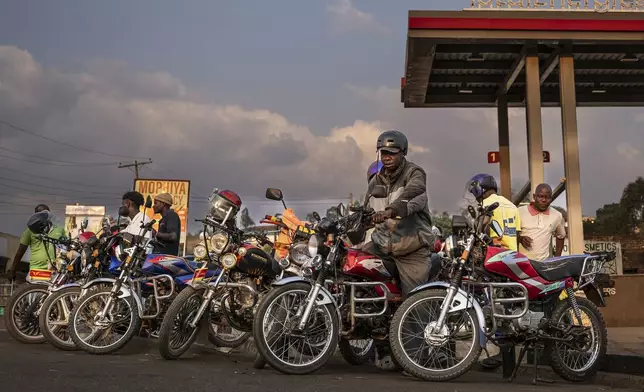Motorcycle taxi drivers wait for customers in Blantyre, Malawi, Tuesday, Sept. 16, 2025. (AP Photo/Thoko Chikondi)