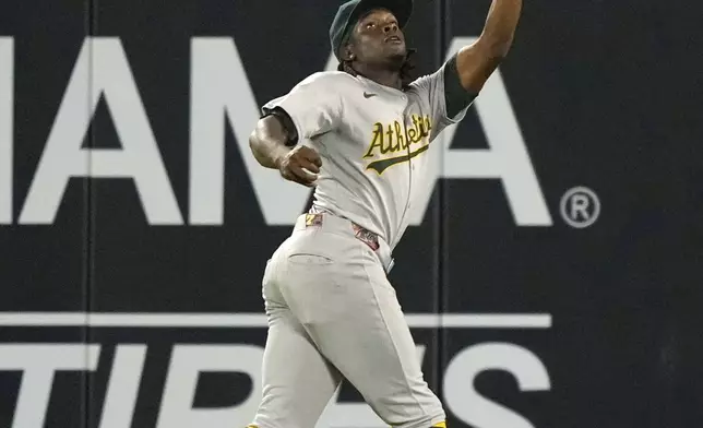 Athletics center fielder Lawrence Butler makes a catch on a ball hit by Los Angeles Angels' Luis Rengifo during the eighth inning of a baseball game Friday, Sept. 5, 2025, in Anaheim, Calif. (AP Photo/Mark J. Terrill)
